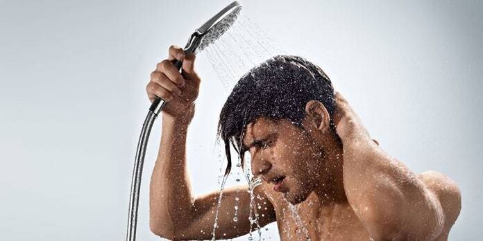 A man takes a contrast shower to increase blood circulation and increase potency