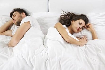 A man with weak potency and a frustrated woman in bed